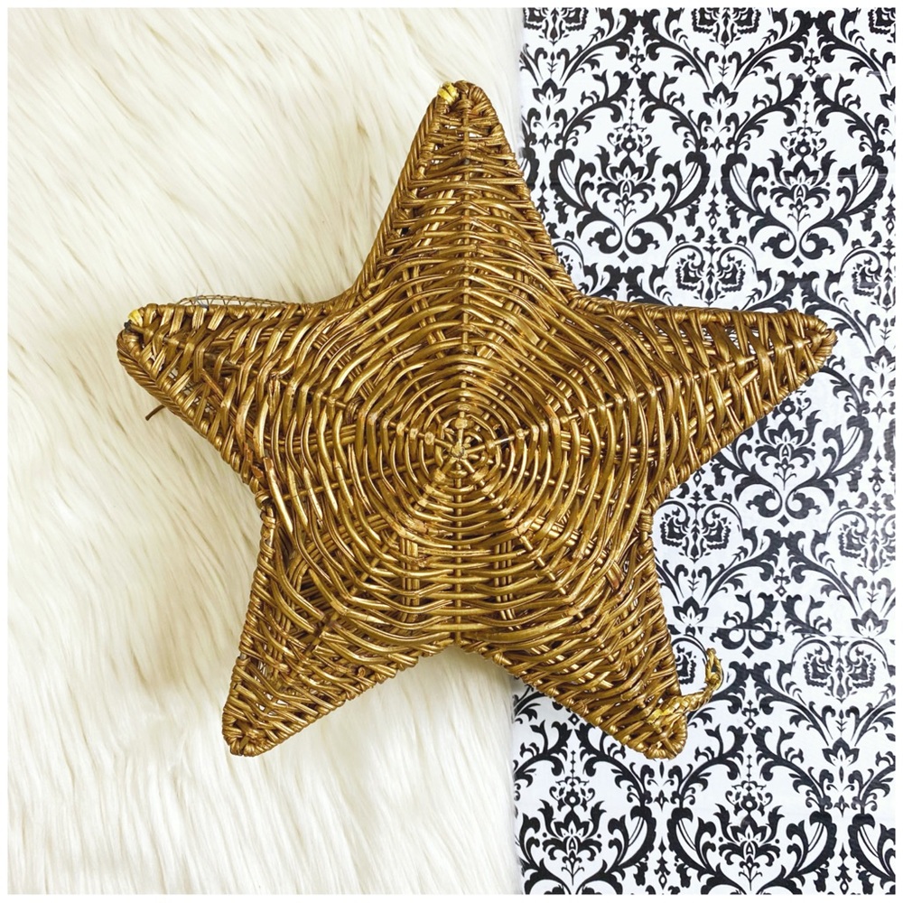 gold colored star shaped wicker and wire storage basket